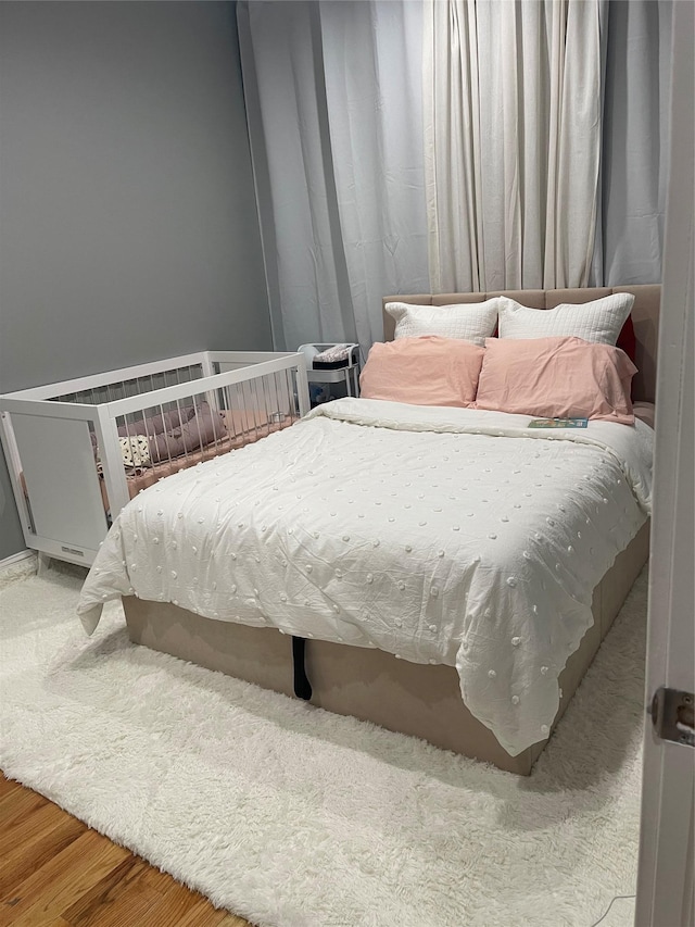 bedroom featuring wood-type flooring