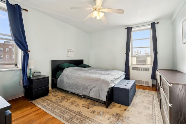 5635 Netherland Ave Unit 4E, Bronx, NY 10471 - bedroom with ceiling fan, radiator, and light hardwood / wood-style flooring