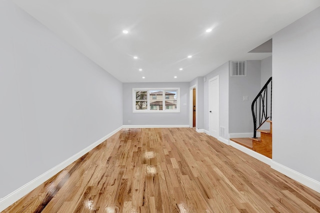 unfurnished living room featuring light wood-type flooring