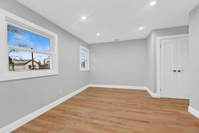 spare room with light wood-type flooring