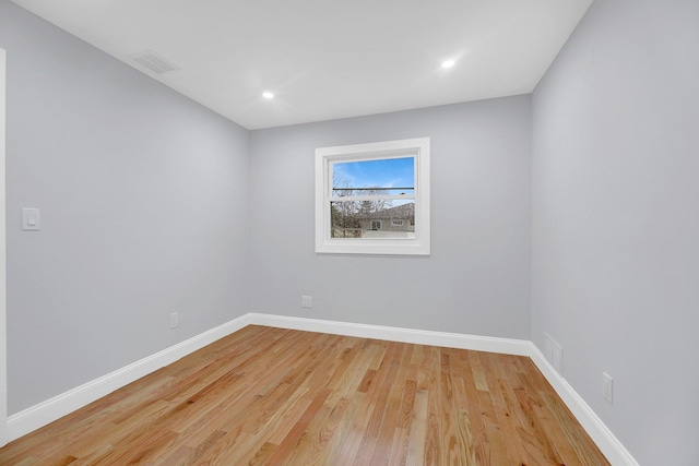 spare room featuring light hardwood / wood-style flooring