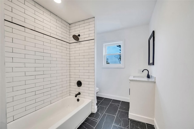 full bathroom with vanity, toilet, and tiled shower / bath combo