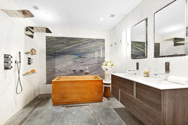 bathroom with plus walk in shower, vanity, and tile walls