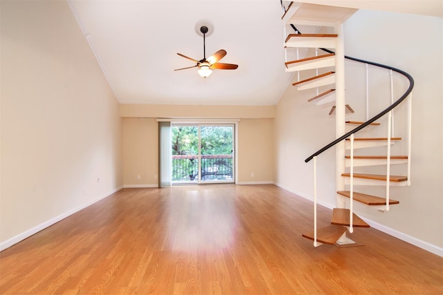 unfurnished living room featuring light wood-type flooring, ceiling fan, and lofted ceiling