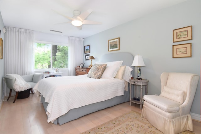 bedroom with light wood-type flooring and ceiling fan