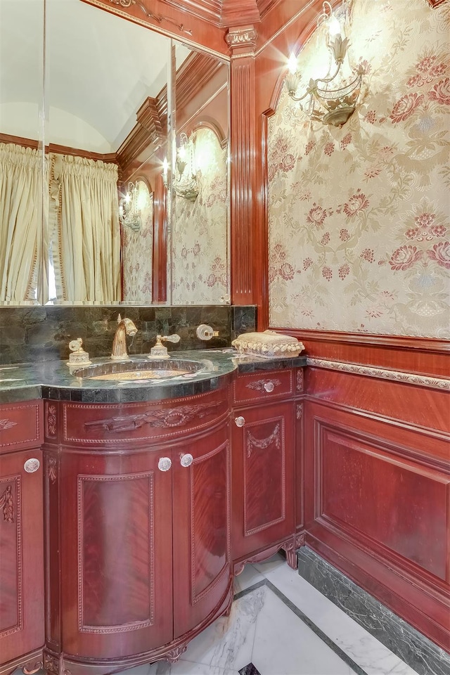 bathroom featuring vanity and ornamental molding