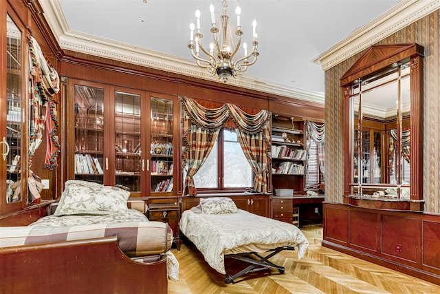 sitting room with an inviting chandelier, light parquet floors, crown molding, and wood walls