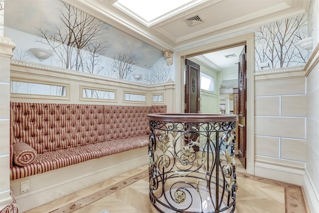 interior space featuring crown molding and light parquet flooring