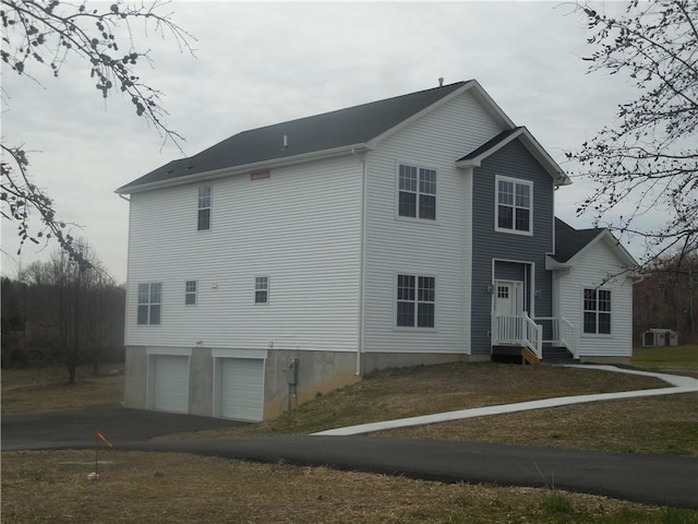 view of property exterior featuring a garage