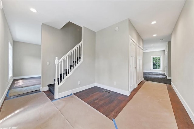 stairway featuring wood-type flooring