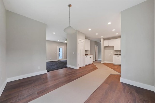 unfurnished living room with wood-type flooring