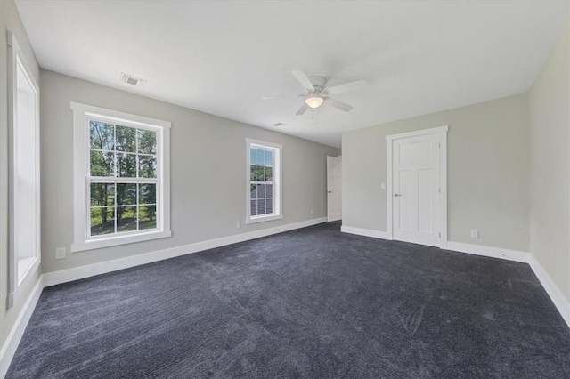 carpeted empty room with ceiling fan