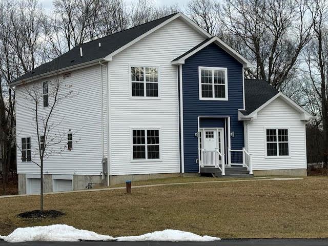 view of front of house with a front lawn