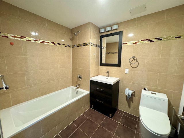 full bathroom featuring tile patterned flooring, tile walls, and toilet