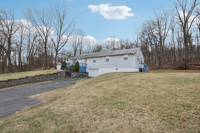 view of property exterior featuring a yard