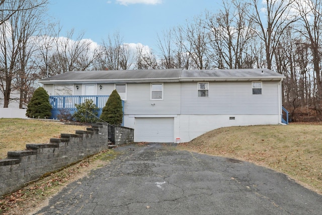 exterior space with a yard and a garage