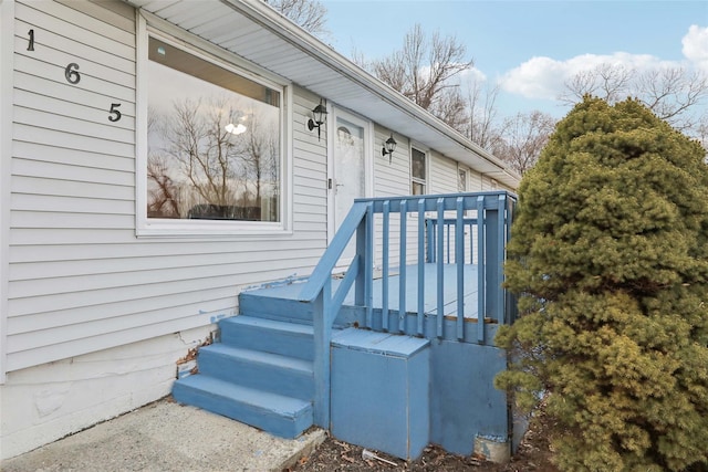 entrance to property featuring a deck