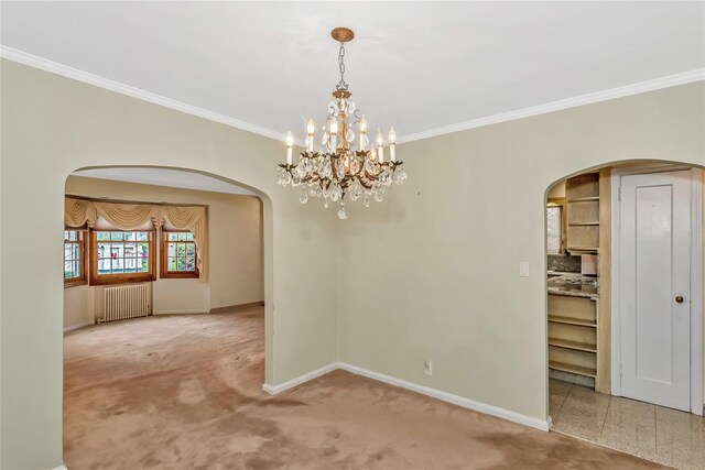 carpeted spare room featuring radiator heating unit, arched walkways, crown molding, baseboards, and a chandelier