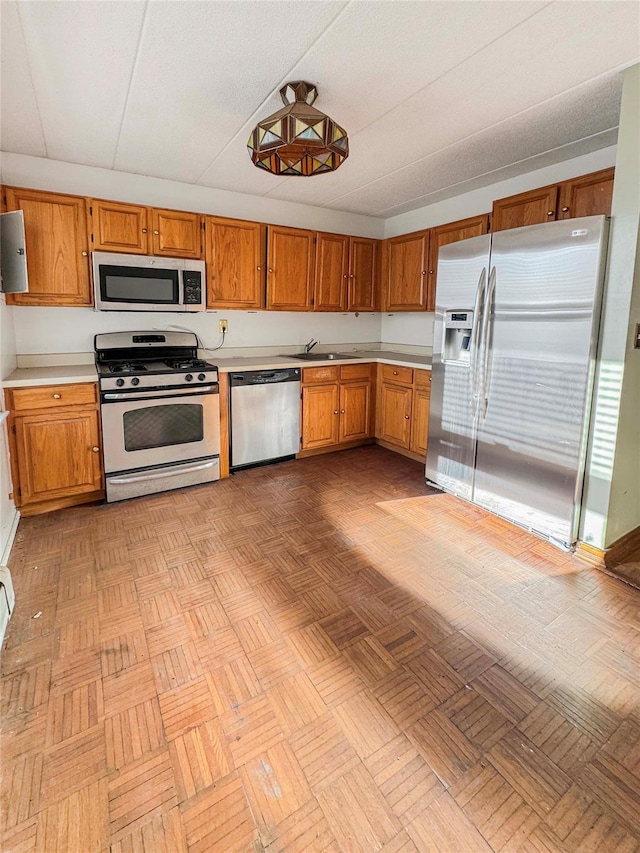 kitchen with appliances with stainless steel finishes and sink