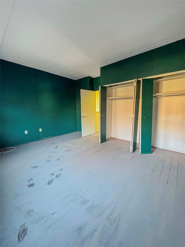 unfurnished bedroom featuring wood-type flooring