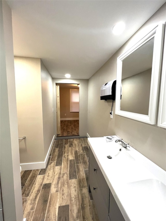 47 Prince St, Middletown, NY 10940 - bathroom featuring wood finished floors, double vanity, baseboards, and recessed lighting
