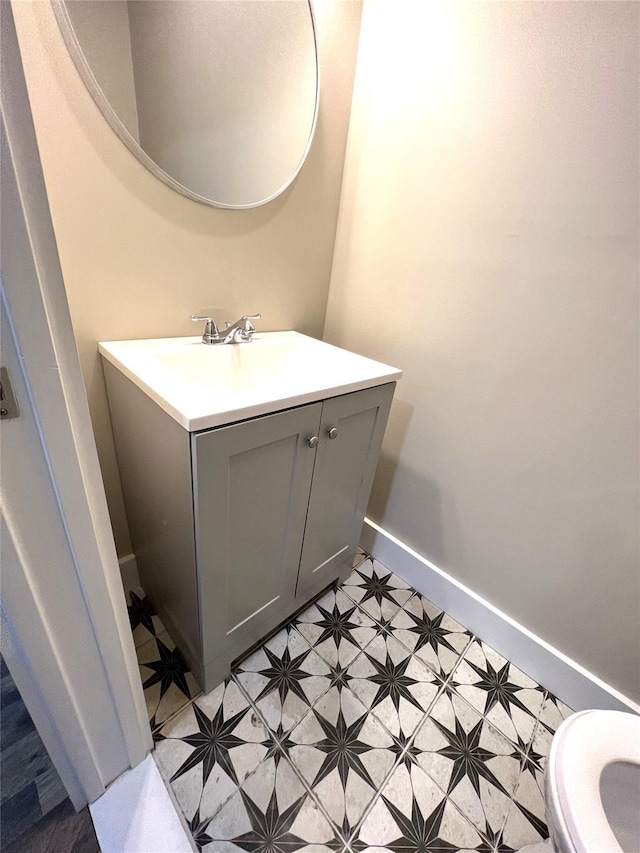 47 Prince St, Middletown, NY 10940 - bathroom featuring vanity, baseboards, and toilet
