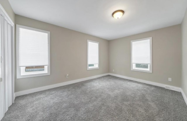 47 Prince St, Middletown, NY 10940 - carpeted empty room featuring healthy amount of natural light and baseboards
