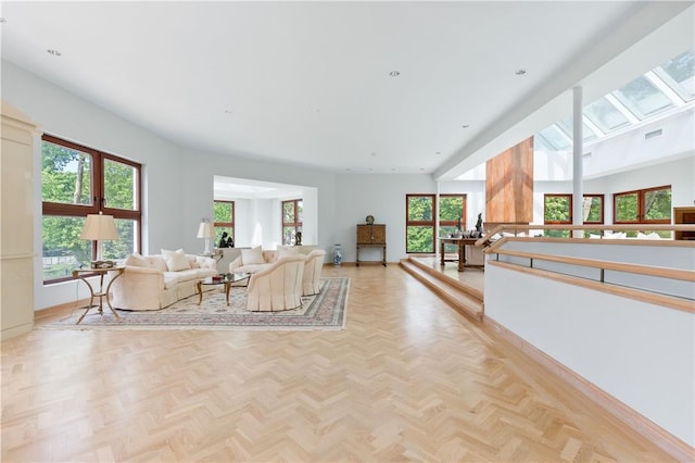 living room with light parquet flooring and plenty of natural light