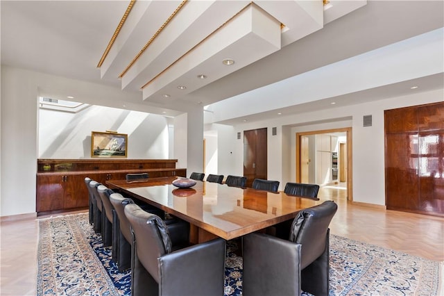 dining area featuring light parquet floors