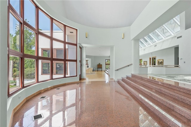 interior space with a towering ceiling