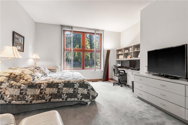 bedroom featuring light colored carpet