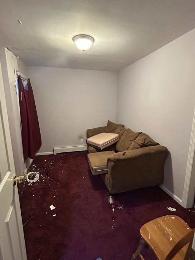 sitting room featuring dark colored carpet and baseboard heating