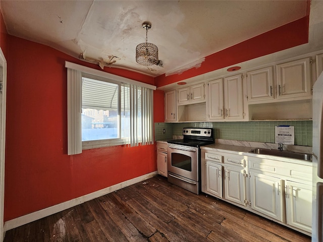 kitchen with dark wood-type flooring, sink, electric range, tasteful backsplash, and decorative light fixtures