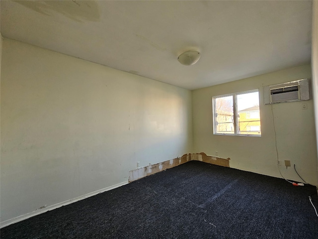 empty room with carpet and a wall mounted air conditioner