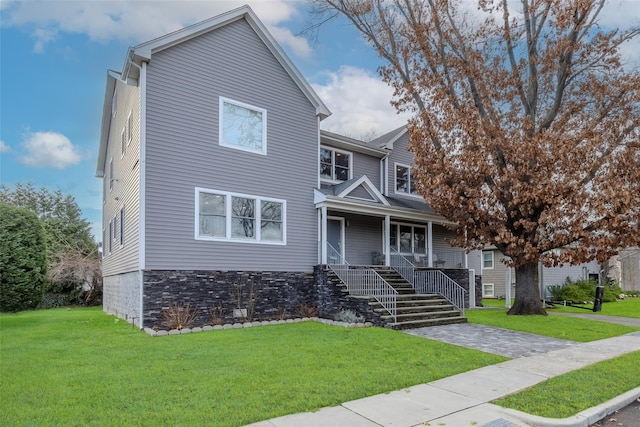 view of front of home featuring a front lawn and a porch