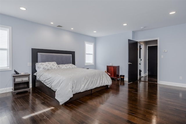 bedroom featuring dark hardwood / wood-style flooring