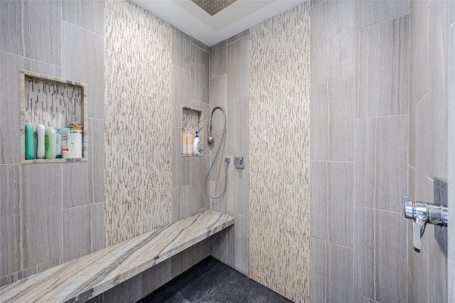 bathroom featuring a tile shower