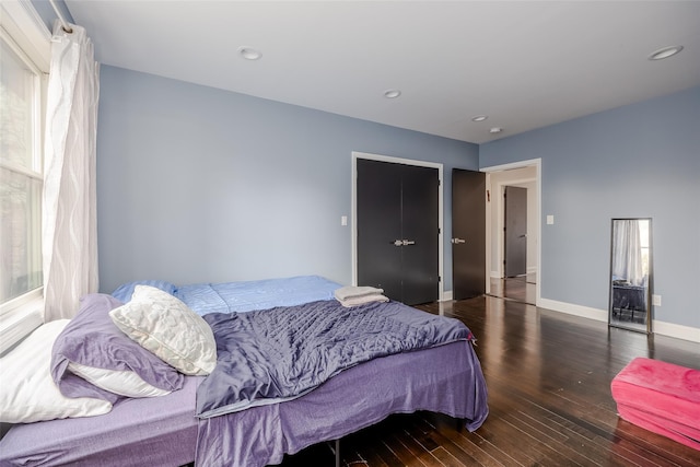 bedroom featuring dark hardwood / wood-style flooring