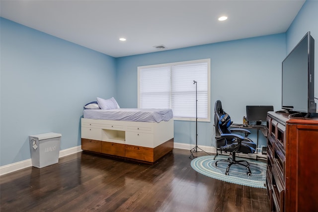 bedroom featuring dark hardwood / wood-style flooring