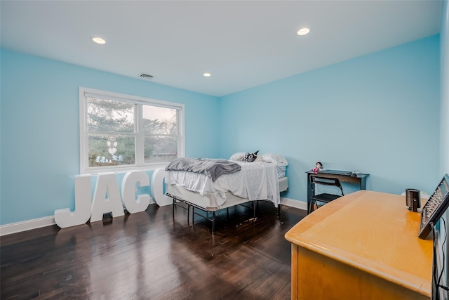 bedroom featuring dark hardwood / wood-style floors