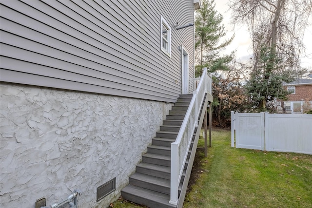 view of home's exterior featuring a lawn