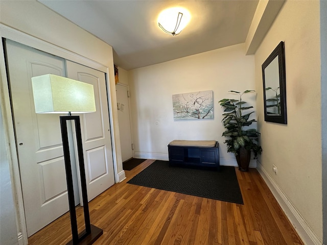 corridor featuring dark wood-type flooring