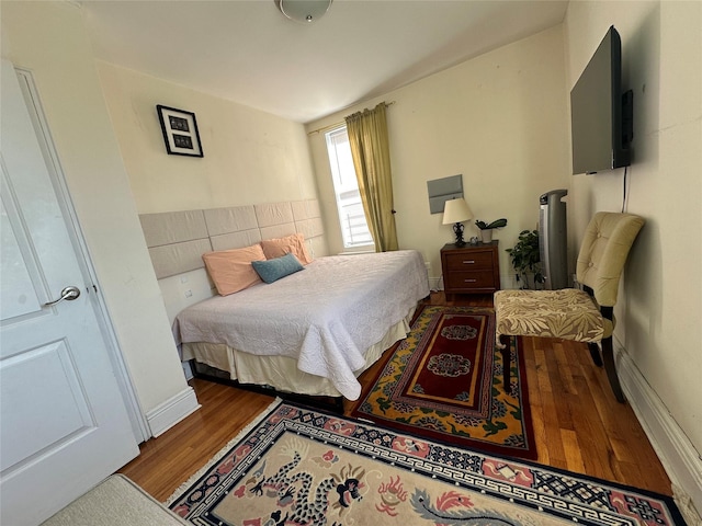 bedroom featuring hardwood / wood-style flooring