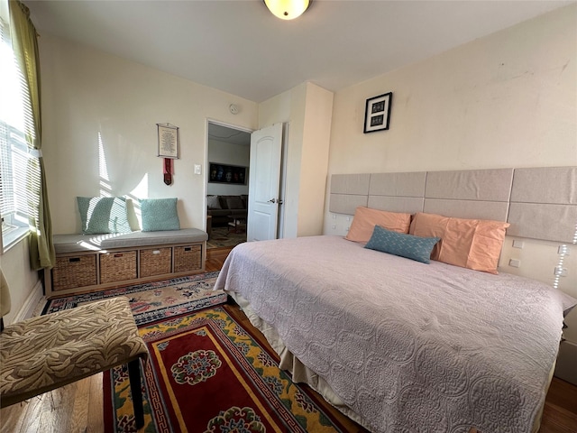 bedroom with hardwood / wood-style flooring