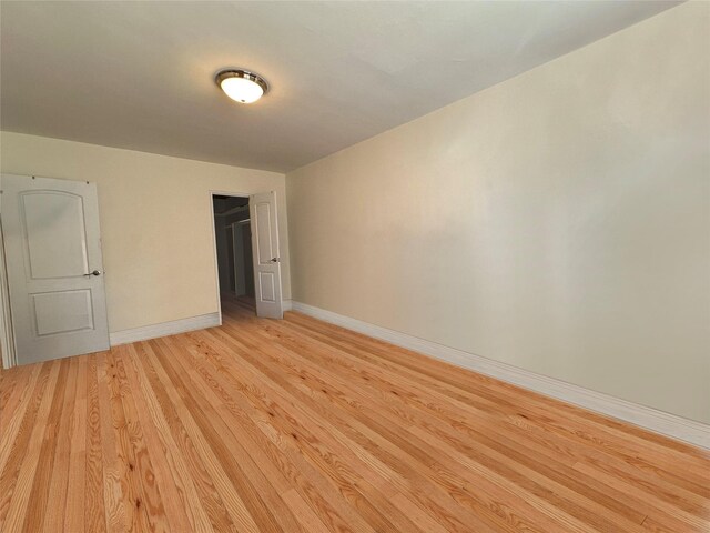 unfurnished bedroom with light wood-type flooring