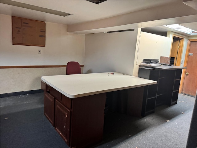 kitchen featuring dark brown cabinets and a kitchen island