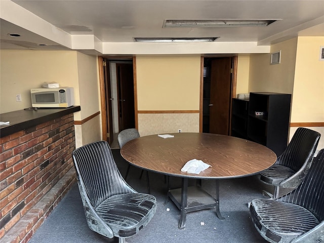 dining room with dark carpet