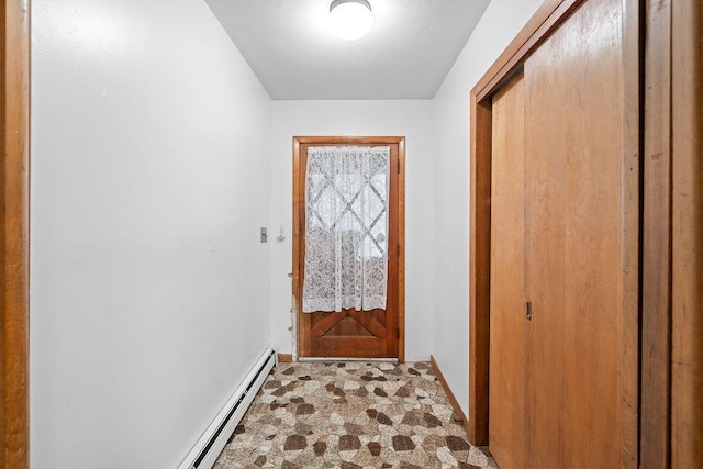 entryway with a baseboard heating unit