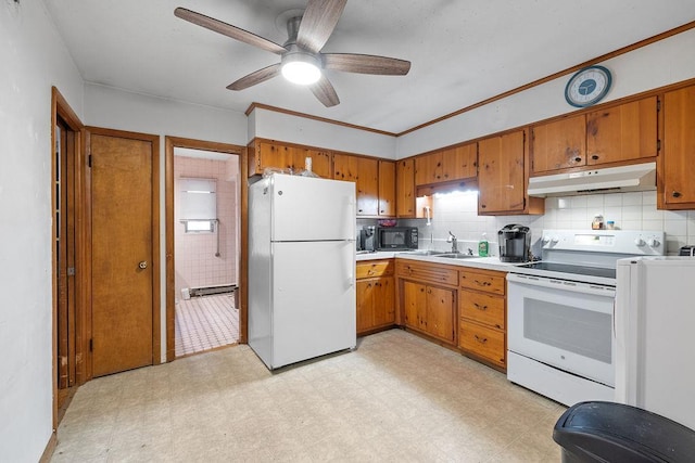 kitchen with a wealth of natural light, ceiling fan, sink, and white appliances