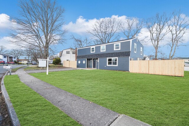 view of front of property with a front lawn